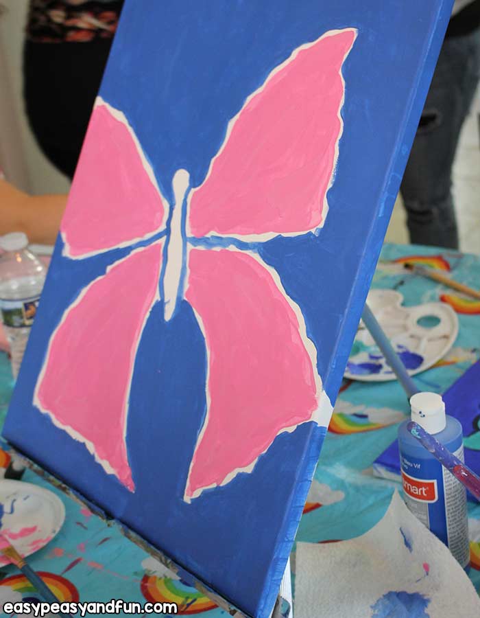 Paint the edges of the butterfly canvas