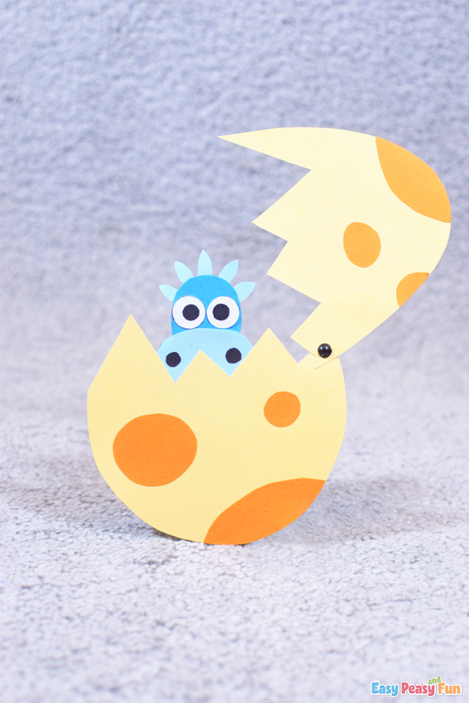 Paper dinosaur coming out of an egg