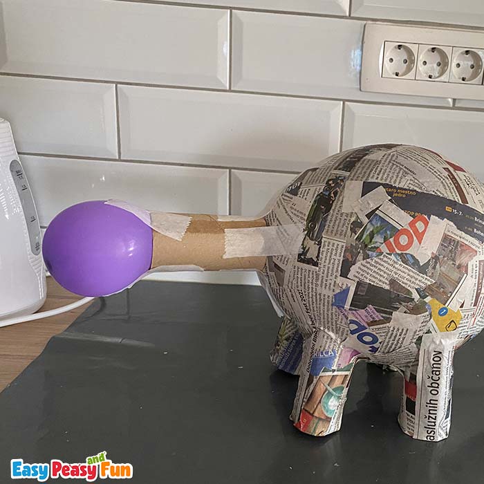 Stegosaur construction made from balloons and toilet paper rolls