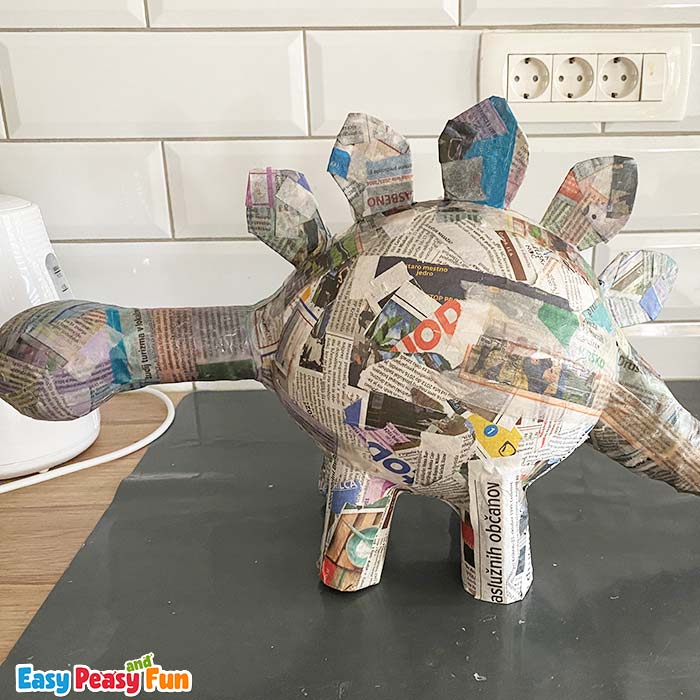 Paper mache dinosaur without paint