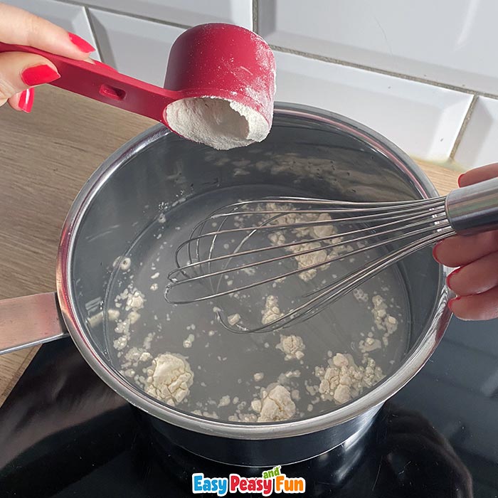 Adding flour to water in saucepan 