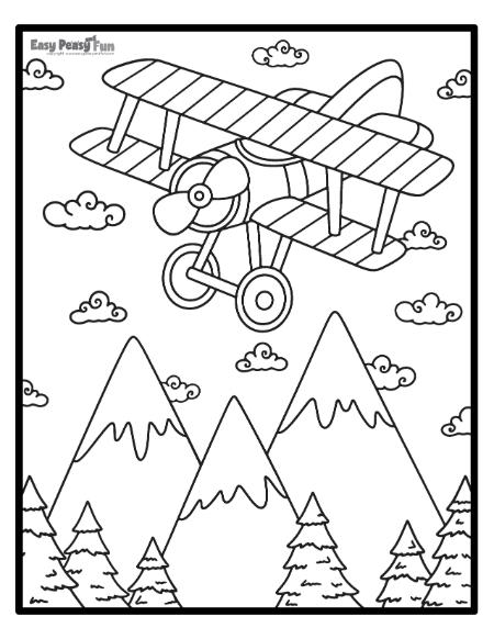 Image of a biplane flying over the mountains and pine trees to color.