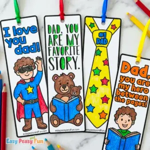 Four colored Father's Day bookmarks featuring a superhero kid "I Love You Dad", bear and cub reading "Dad You Are My Favorite Story", a starry #1 Dad tie, and a curly haired bookworm kid "Dad You Are My Hero Between The Pages".