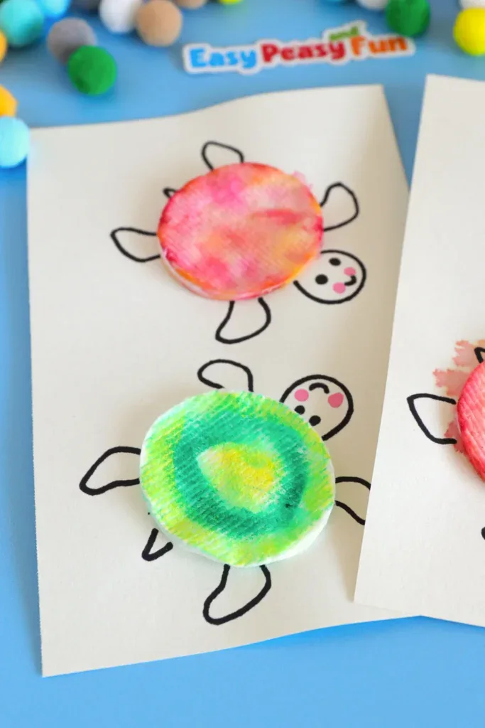 Two paper drawings featuring turtle outlines with vibrant pink, orange, green, and yellow textured cotton pad turtles.