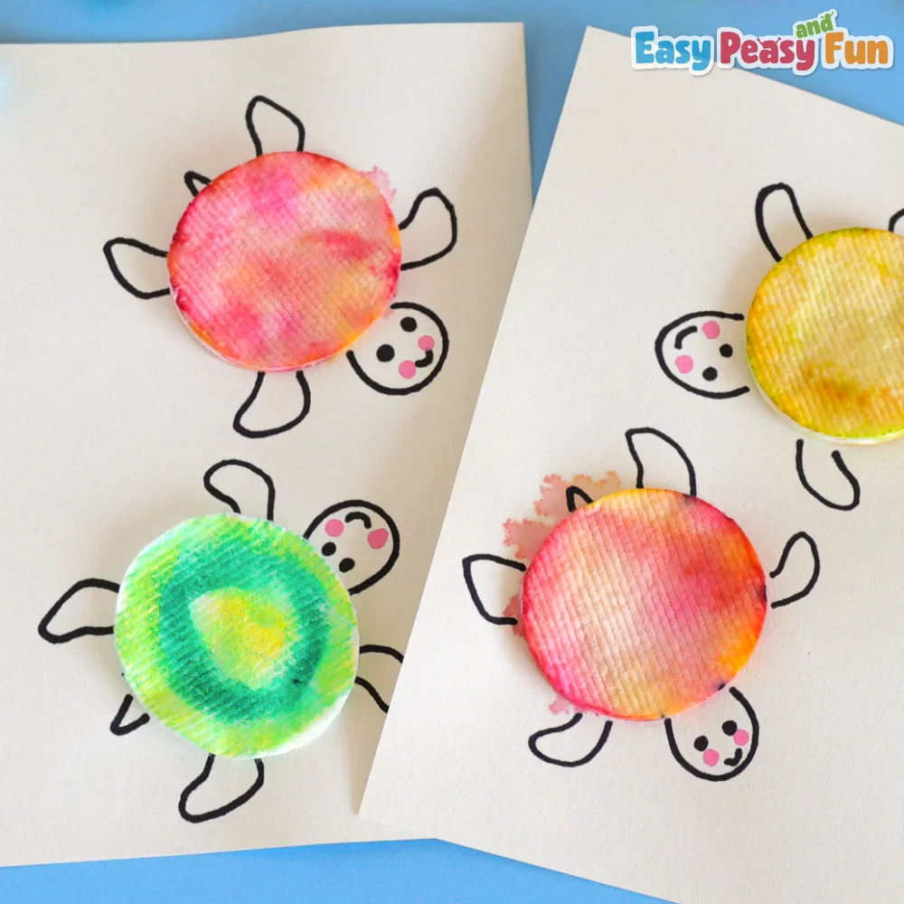 Four hand-drawn turtles on paper with round, colorful cotton pad shells in varied gradients of pink, yellow, and green.