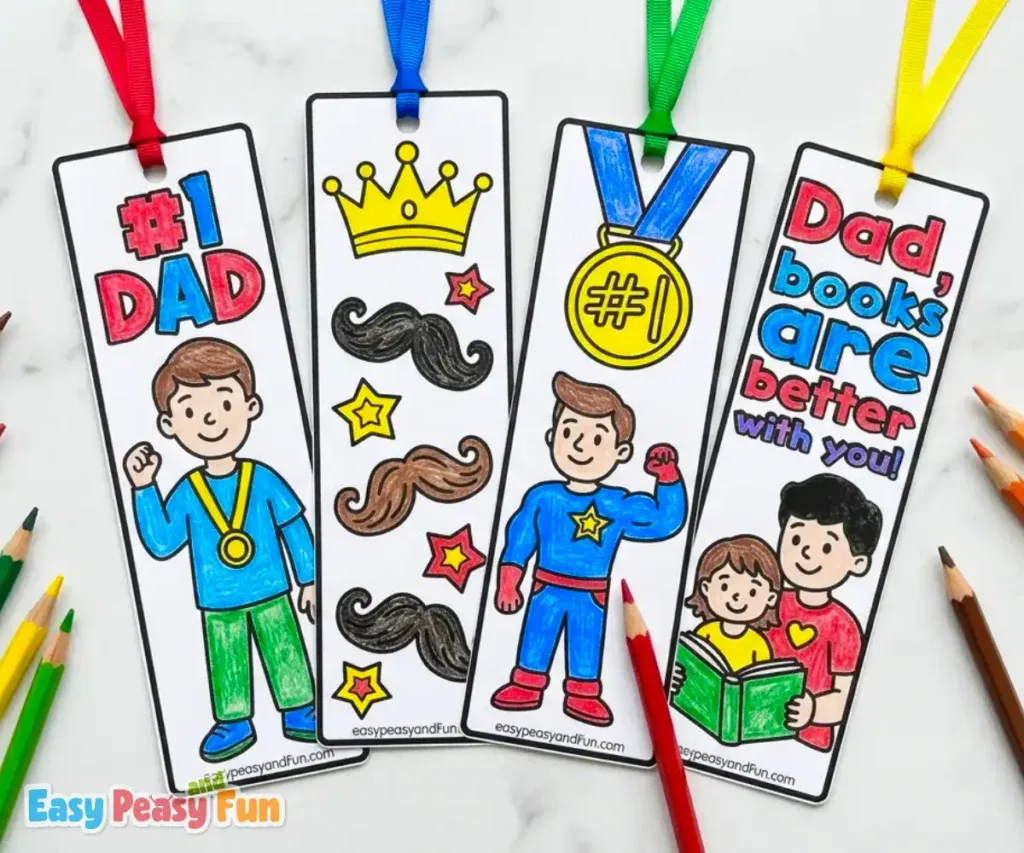 Four colored Father's Day bookmarks with ribbons featuring a #1 Dad with medal, mustaches and stars with a crown, a flexing superhero dad with #1 medal, and a dad and child reading "Dad, Books Are Better With You".