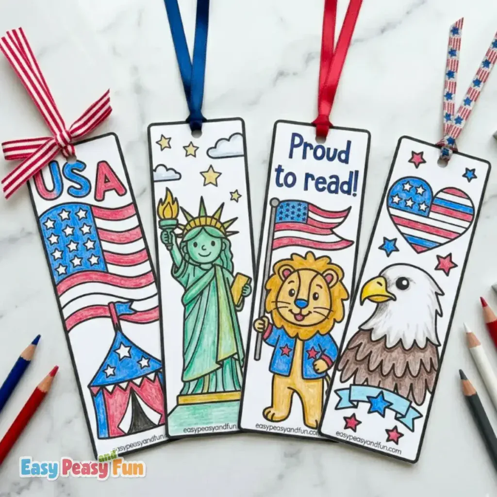 Four hand-colored patriotic bookmarks with ribbons, featuring a circus tent under an American flag, the Statue of Liberty, a lion holding a flag, and a bald eagle.