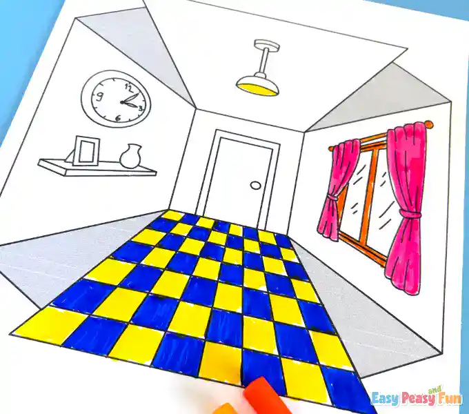 A brightly colored paper floor and wall assembly being prepared.