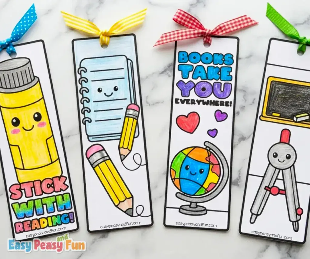 Four completed back-to-school paper bookmarks showing a yellow glue stick, a notebook with pencils, a smiling globe with hearts, and a classroom chalkboard with a compass.