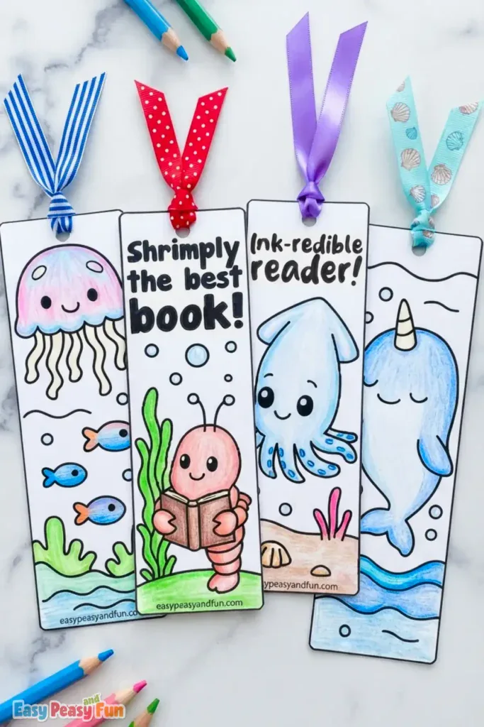 Four colored bookmarks featuring a jellyfish, shrimp, squid, and narwhal with ribbon tops.