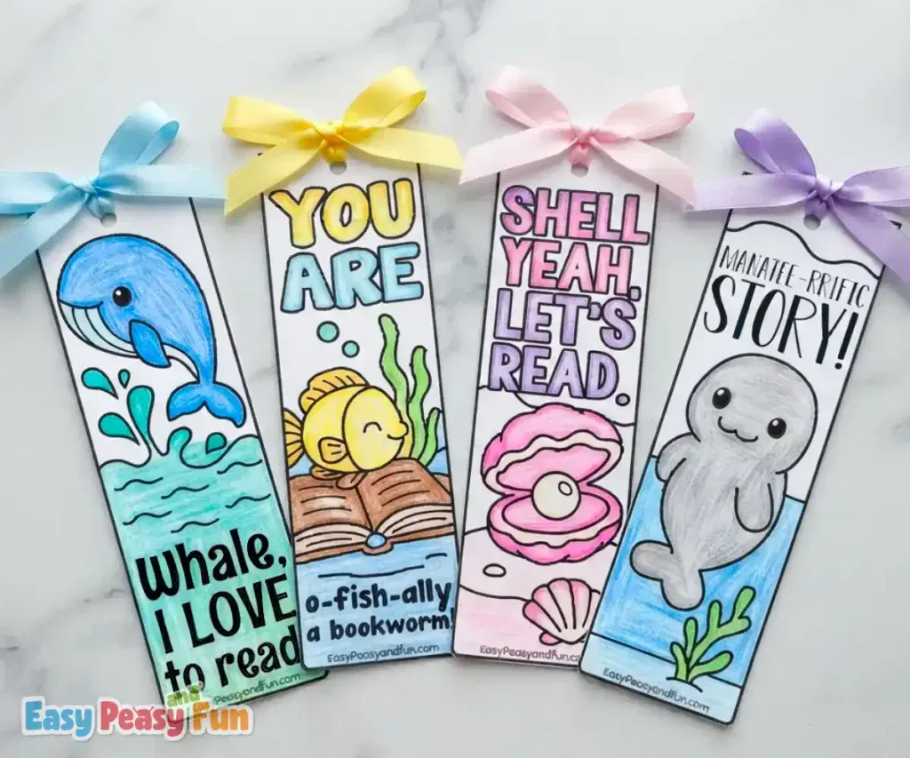 Four colored bookmarks featuring a whale, fish, clam, and manatee with ribbon tops
