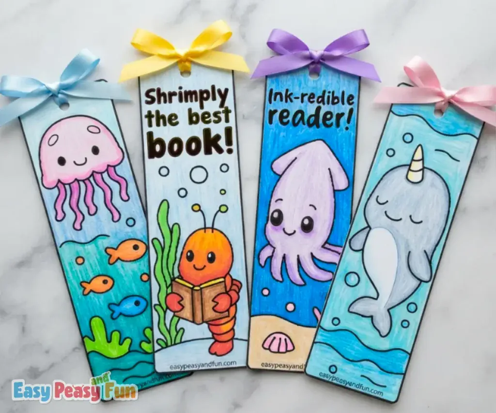 Four colored bookmarks featuring a jellyfish, shrimp, squid, and narwhal with ribbon tops.