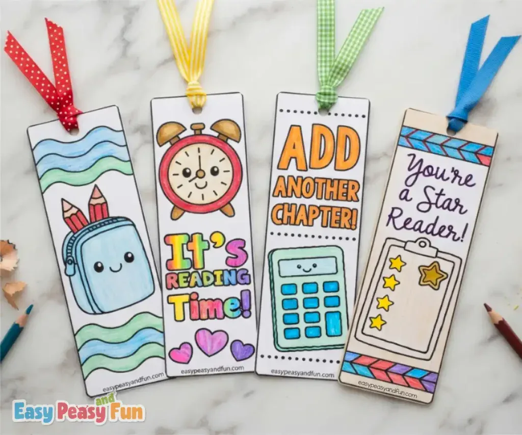 Four decorative paper bookmarks depicting a blue pencil pouch with pencils, a red alarm clock, a blue calculator, and a yellow star-rating clipboard.