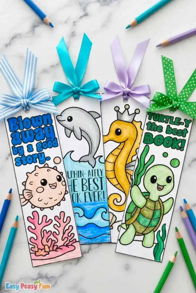 Four colored bookmarks featuring a pufferfish, dolphin, seahorse, and turtle with ribbon tops.