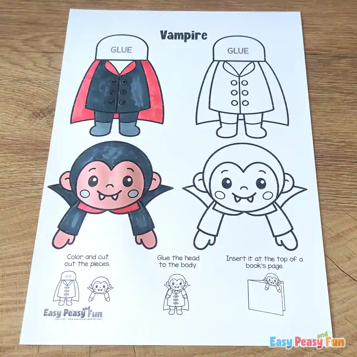 A vampire craft template sheet with one set fully colored in black, red, and grey, alongside a blank template and marker pens.