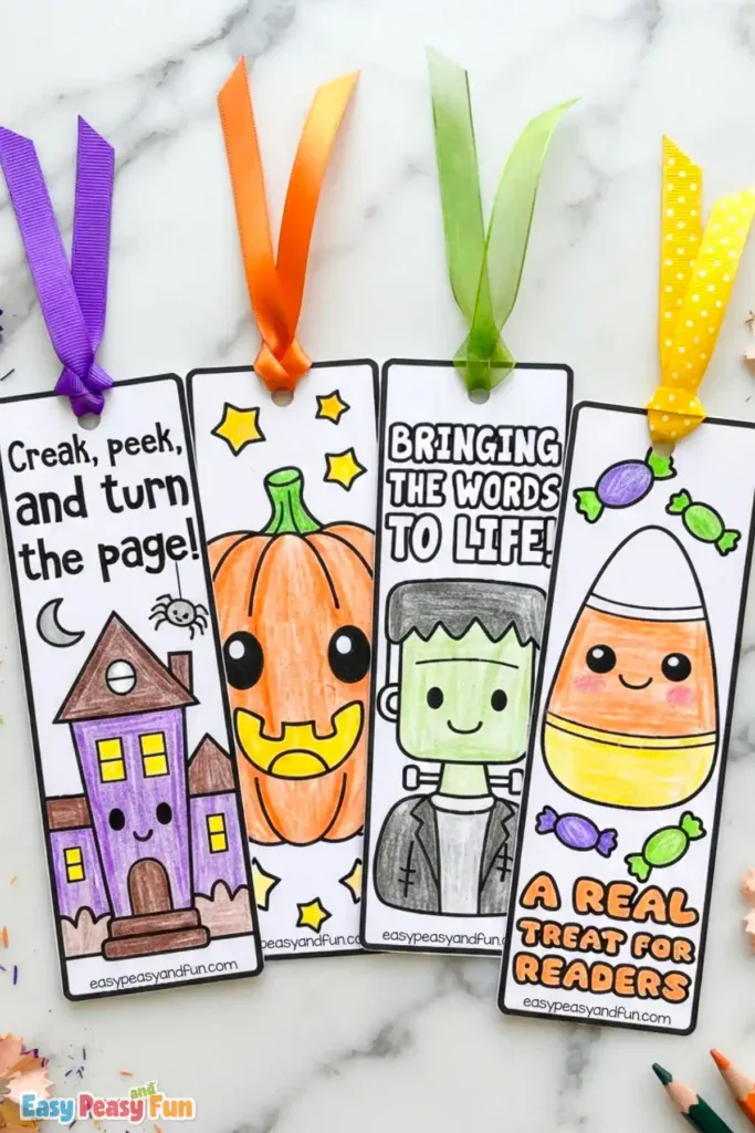 Four colored Halloween bookmarks featuring a haunted house, a pumpkin, Frankenstein's monster, and candy corn with colorful ribbons.