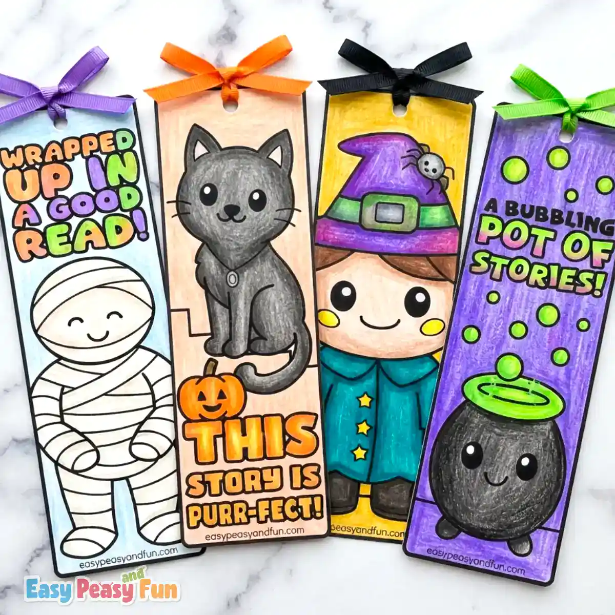 Four colored Halloween bookmarks featuring a mummy, a black cat, a witch, and a bubbling cauldron with ribbons.