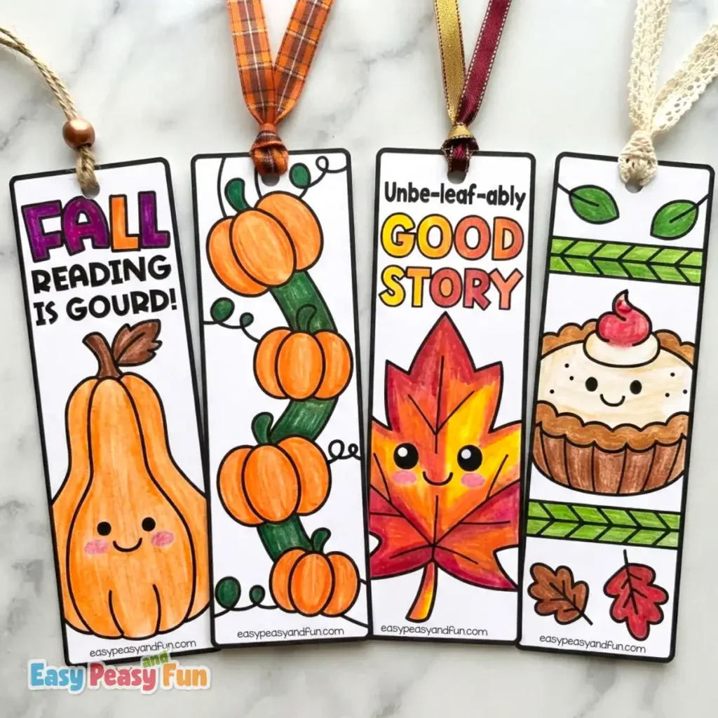 Four colored bookmarks showing a squash, a pumpkin vine, a smiling maple leaf, and a sweet pie.