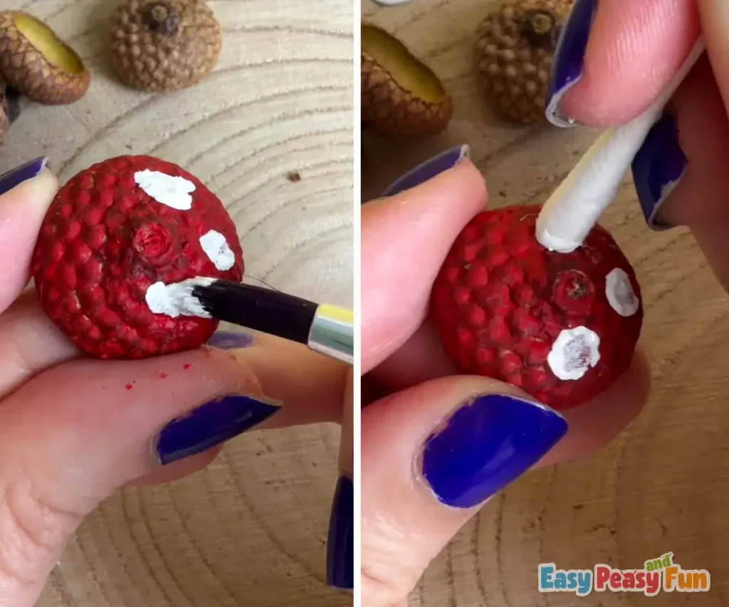 Small white dots are carefully painted onto the red cap to give it a classic mushroom look.