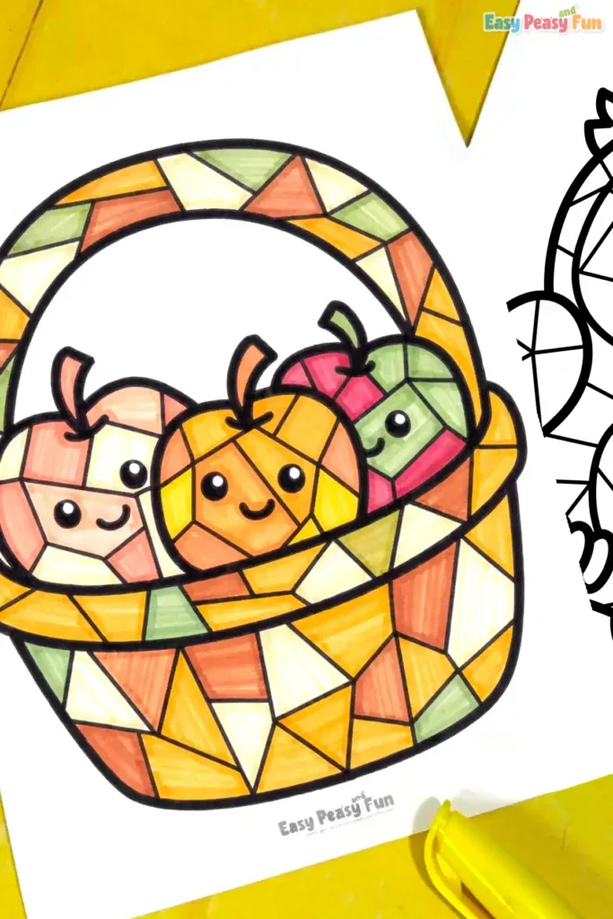 A finished, colored mosaic apple basket page surrounded by markers on a bright yellow background.