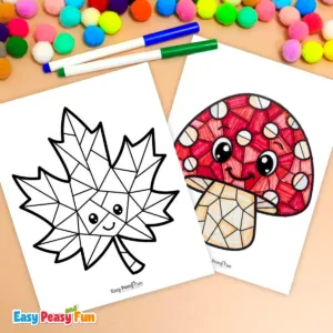 Two printable coloring pages—one uncolored smiling maple leaf and one fully colored red mushroom—surrounded by colorful markers and pom-poms.