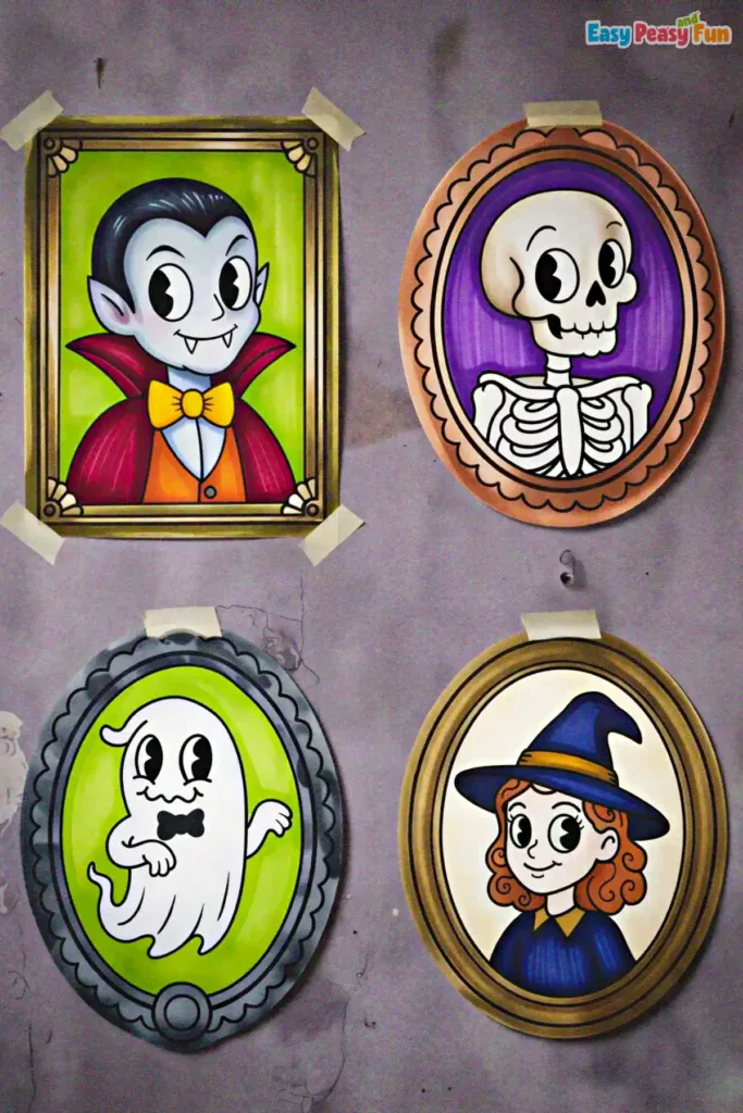 Four finished, colored Halloween portraits taped to a wall.