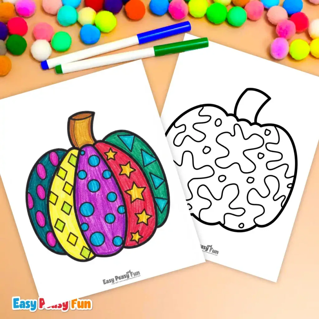 A colored pumpkin sheet next to a blank one, surrounded by markers and pom-poms.