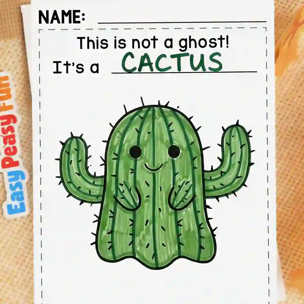 Green ghost craft with ridges, drawn spines, and two arms to look like a smiling cactus.