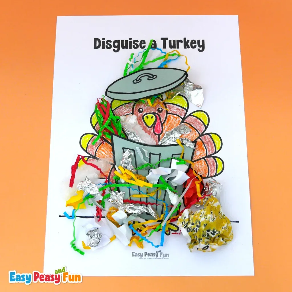 A paper turkey craft disguised as a trash can, covered with colorful shredded paper, foil, and a grey paper bin lid.
