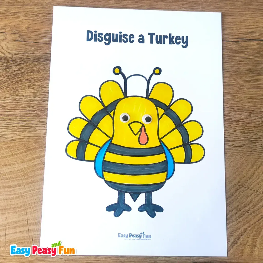 A paper turkey craft template disguised as a yellow and black striped bumblebee with googly eyes and antennae.