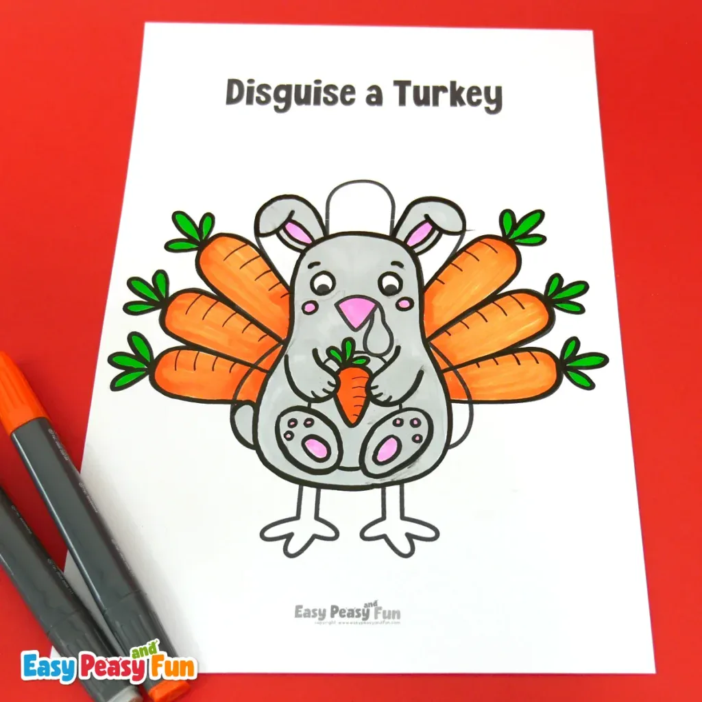 A paper turkey craft template disguised as a gray bunny holding a carrot with carrot-shaped feathers behind it.