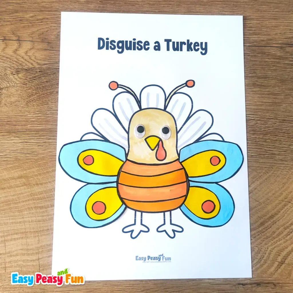 A paper turkey craft template disguised as a butterfly featuring large blue and yellow wings, antennae, and an orange striped body.