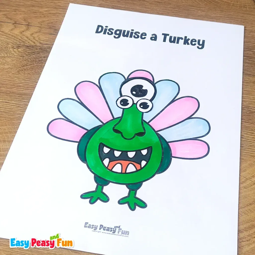 A paper turkey craft template disguised as a green multi-eyed monster with large white teeth.
