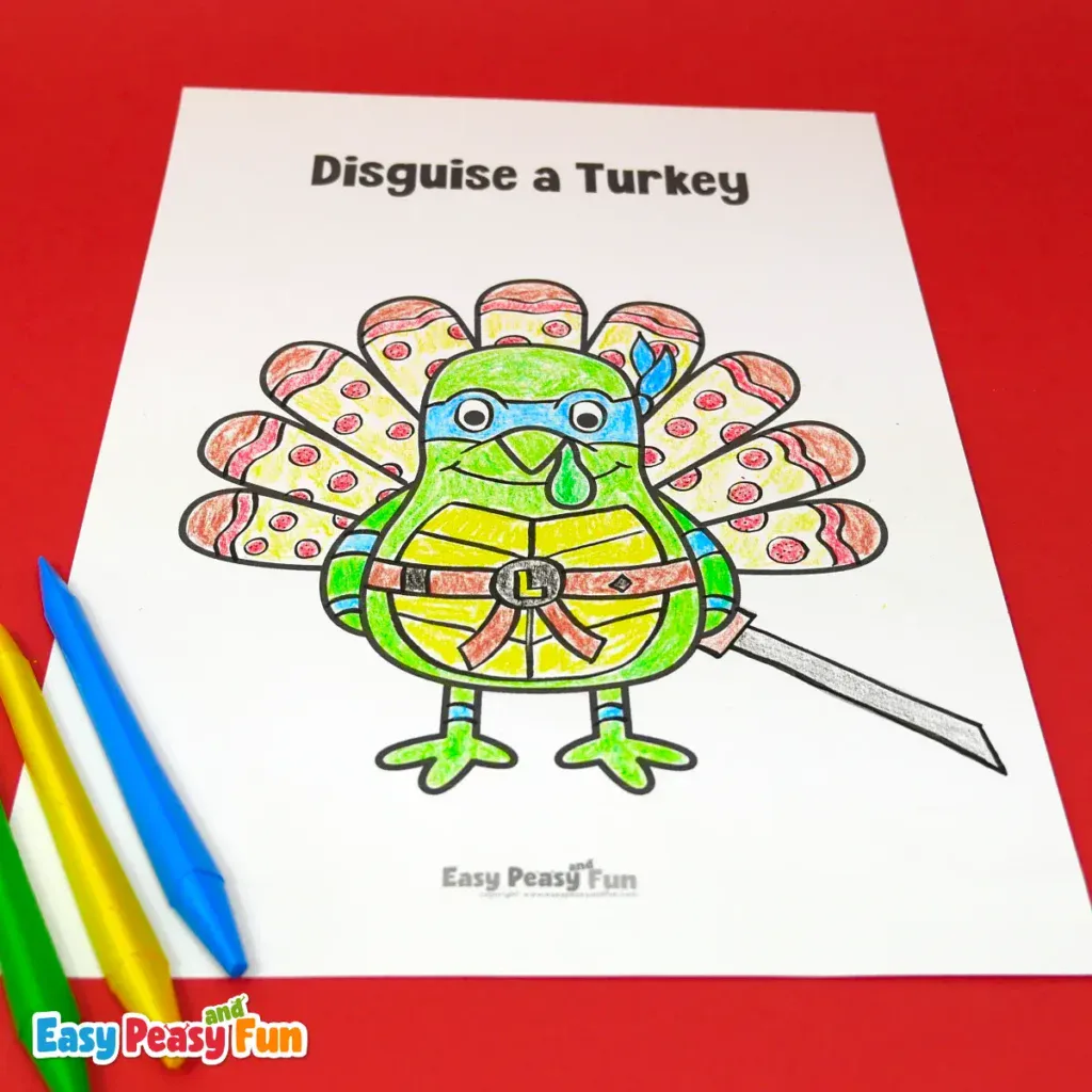 A paper turkey craft template disguised as a green ninja turtle with a blue mask, a shell-patterned body and feathers, and a sword.