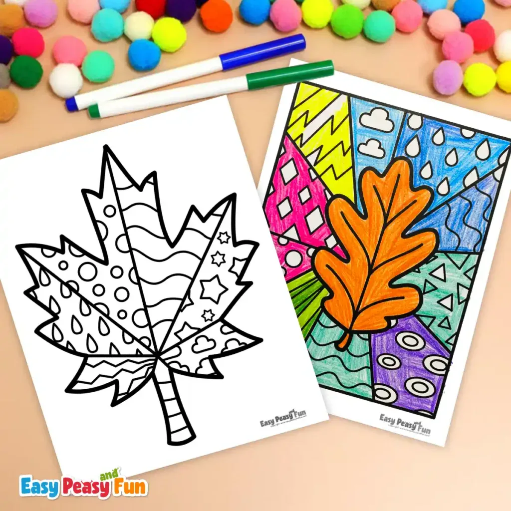 Two printed leaf coloring pages and markers arranged on a light surface.