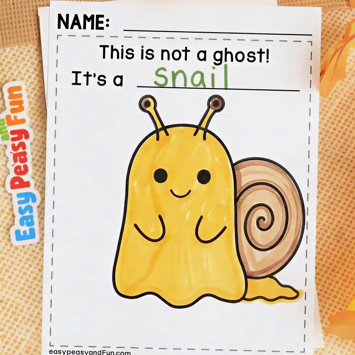 Yellow ghost craft with eye stalks and a brown spiral shell on its back to look like a snail.